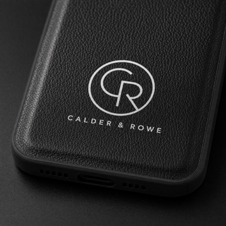 Close-up of white logo printed on black vegan leather iPhone case