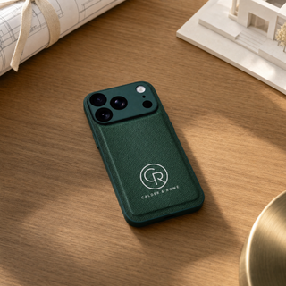 Green vegan leather iPhone case with company logo on an architect desk