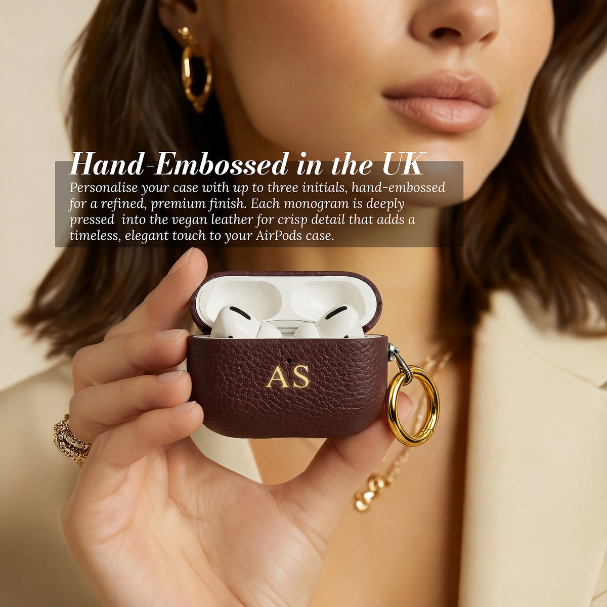 Hand-embossed initials - AirPods case open showing AirPods